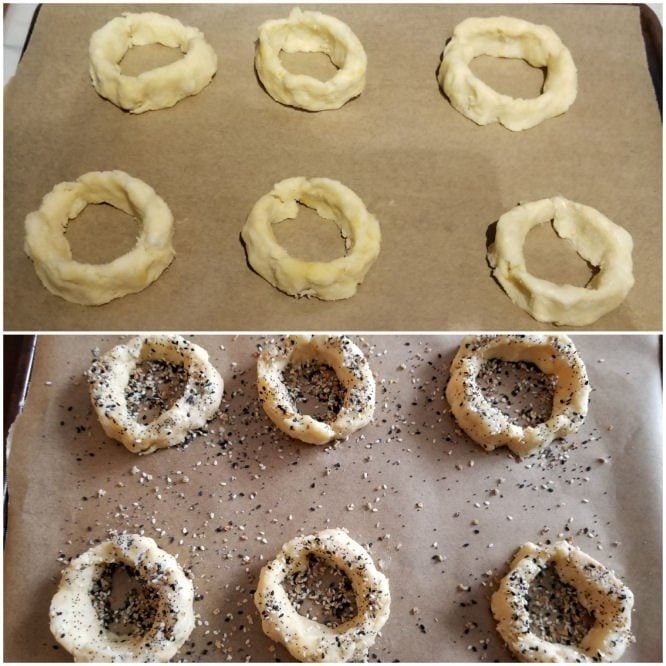 Sprinkling Everything but the Bagel seasoning on keto low-carb bagels before baking.