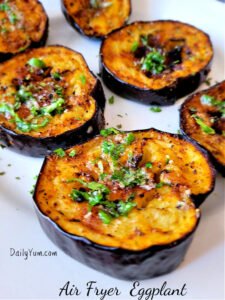 Air Fryer Eggplant slices topped with garlic butter