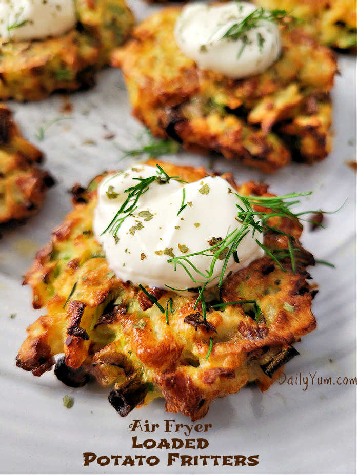 potato fritters with sour cream on top