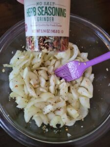sliced onions with seasoning