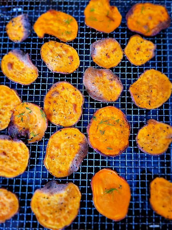 Sweet potato chips in the air fryer basket tray