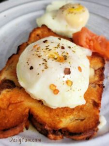round poached egg on a golden brown toast