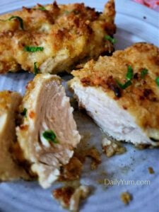 Golden brown, crispy breaded chicken breast cooked in the air fryer, showcasing a juicy and tender interior