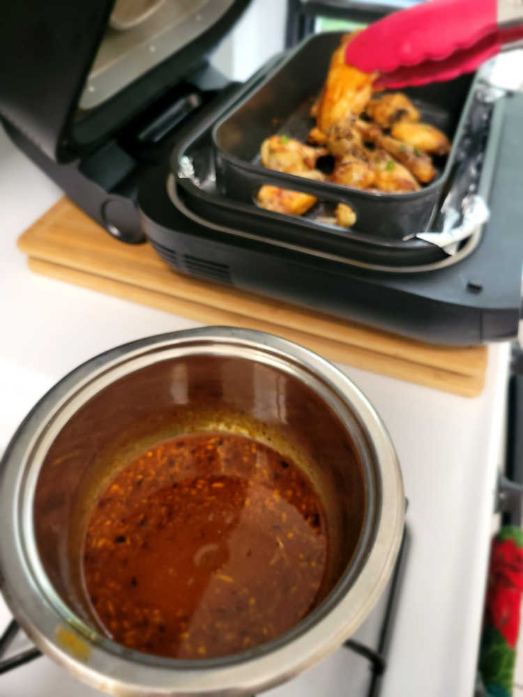 While the wings are cooking in the air fryer, prepare the sauce