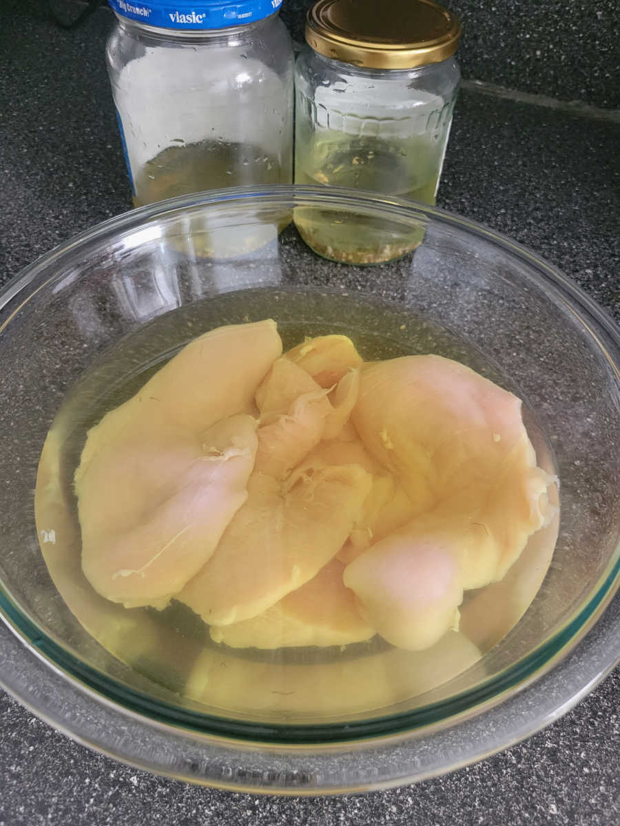 chicken breast marinating in pickle juice brine