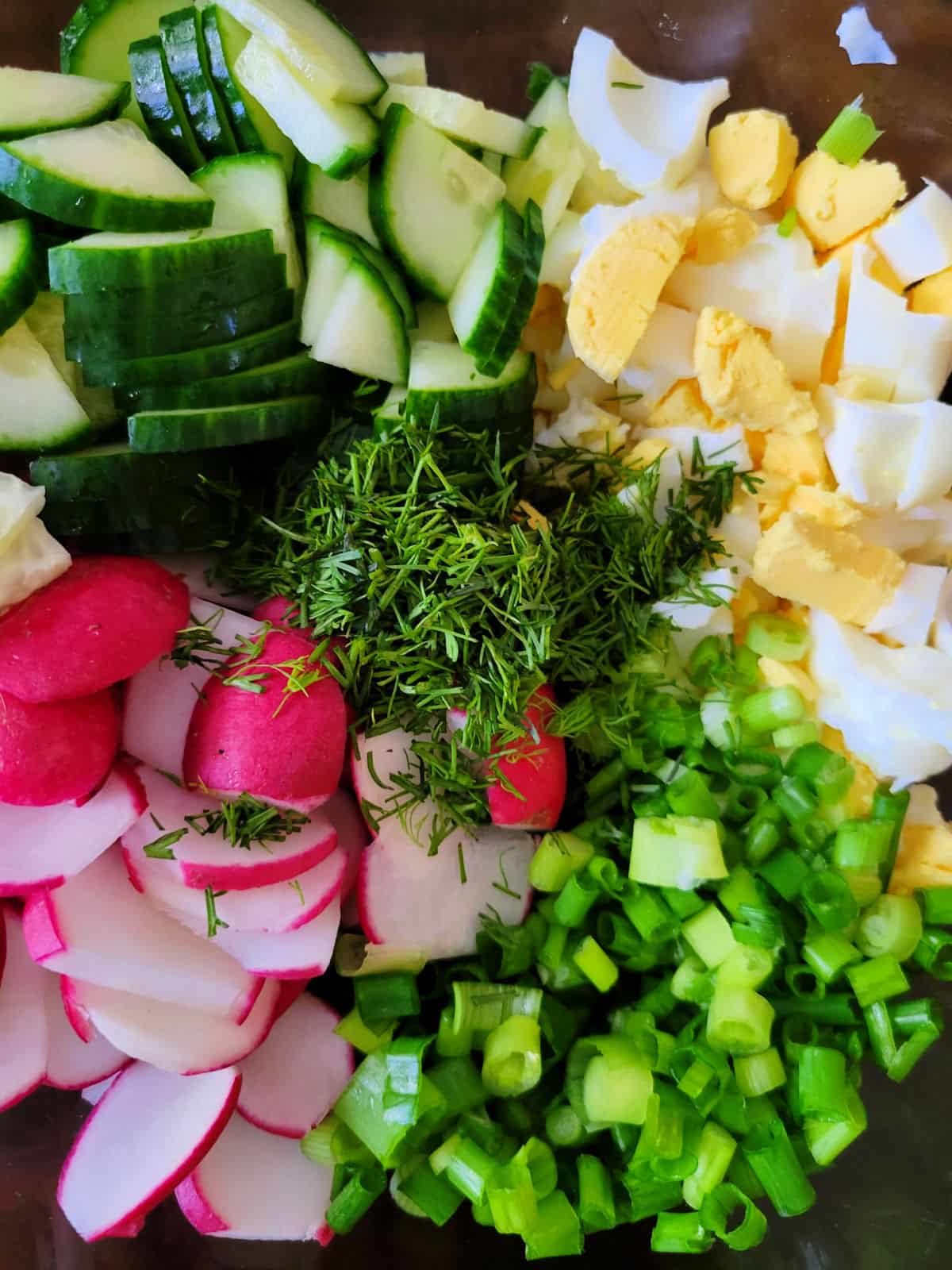 thinly sliced radishes, cucumbers and eggs for refreshing salad