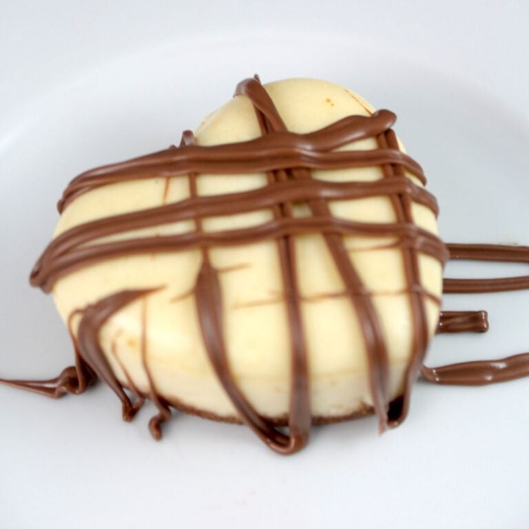 heart shaped cheesecake drizzled with chocolate