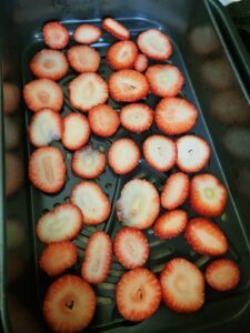 laying strawberry slices in air fryer