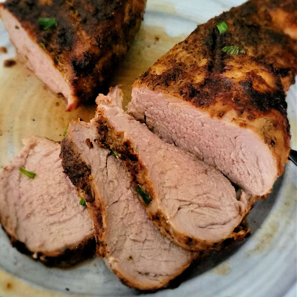 sliced cut of pork with juices