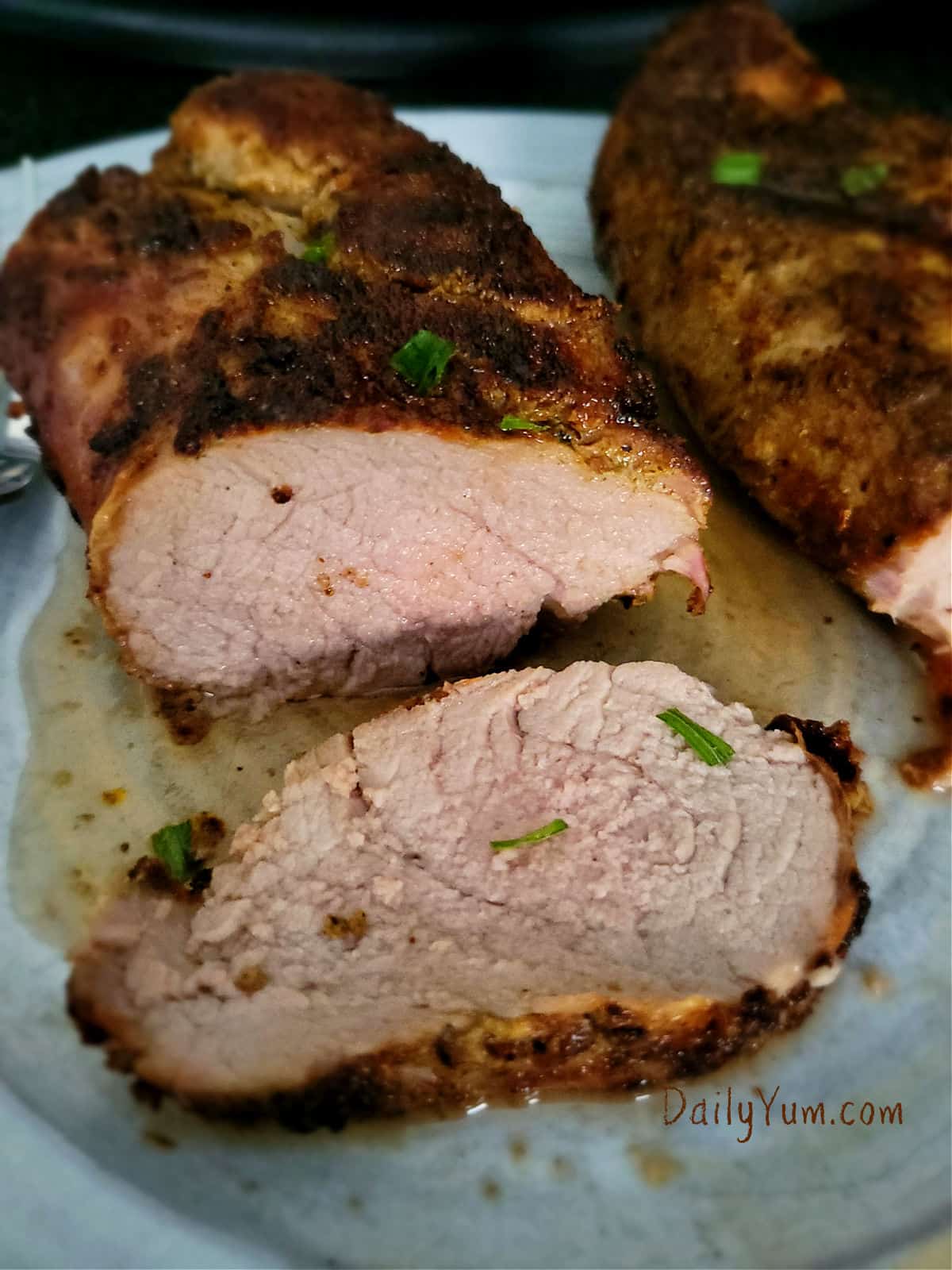 sliced pork tenderloin with juices
