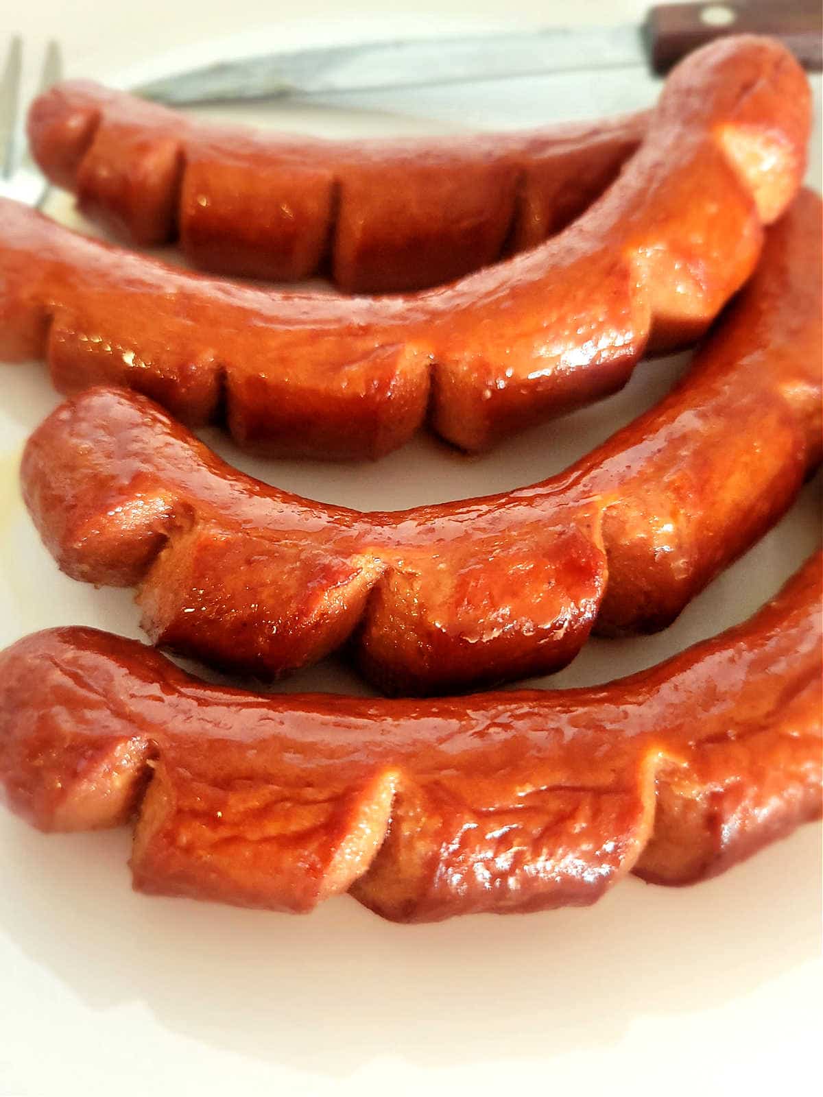 curved hot dog with slits