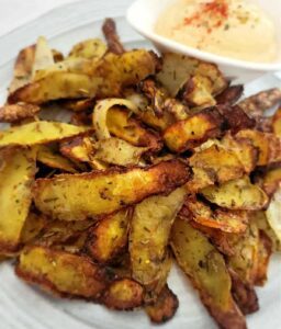 cooked potato peels served with dip