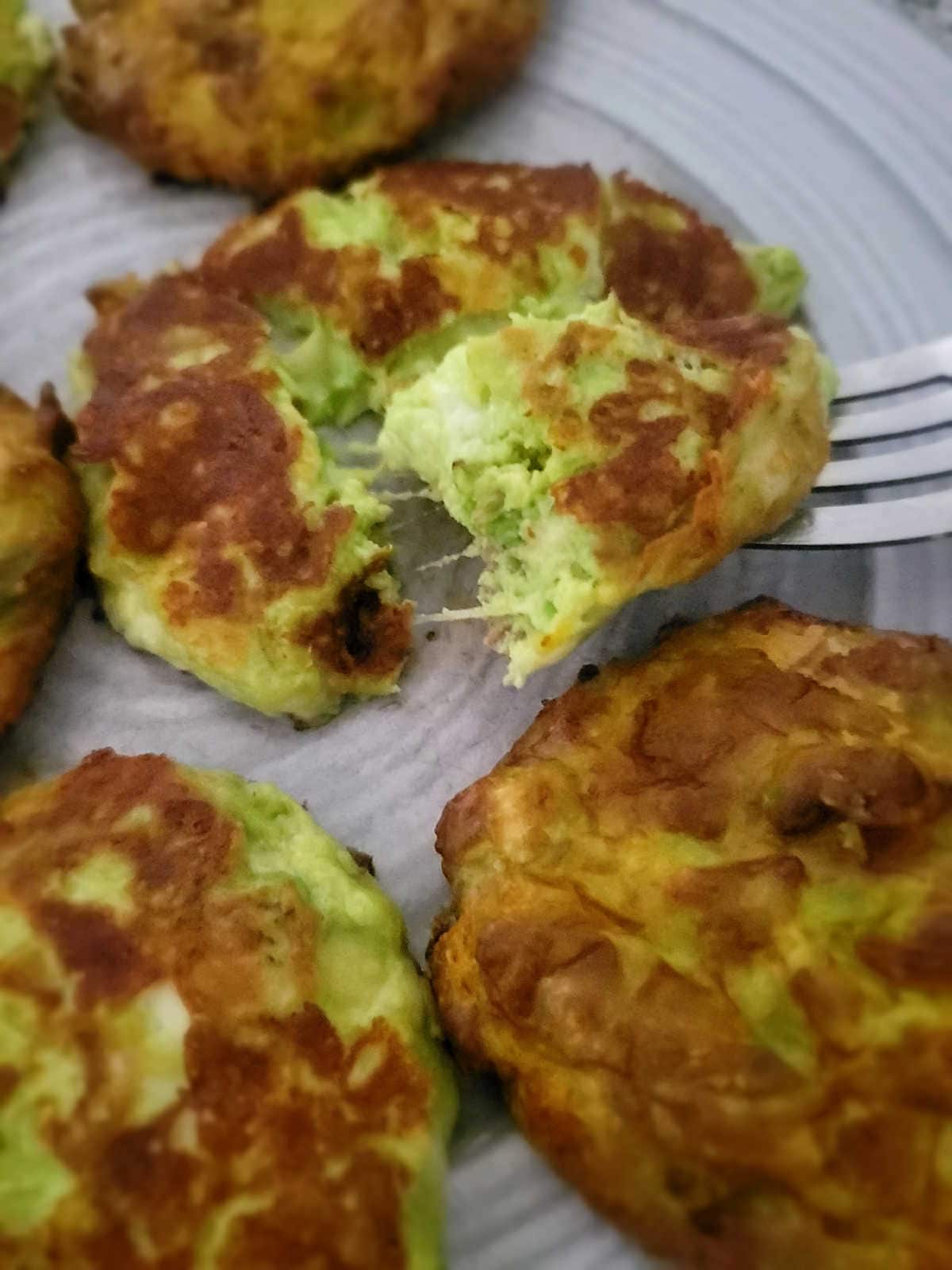 cheese pull from fried avocado fritter