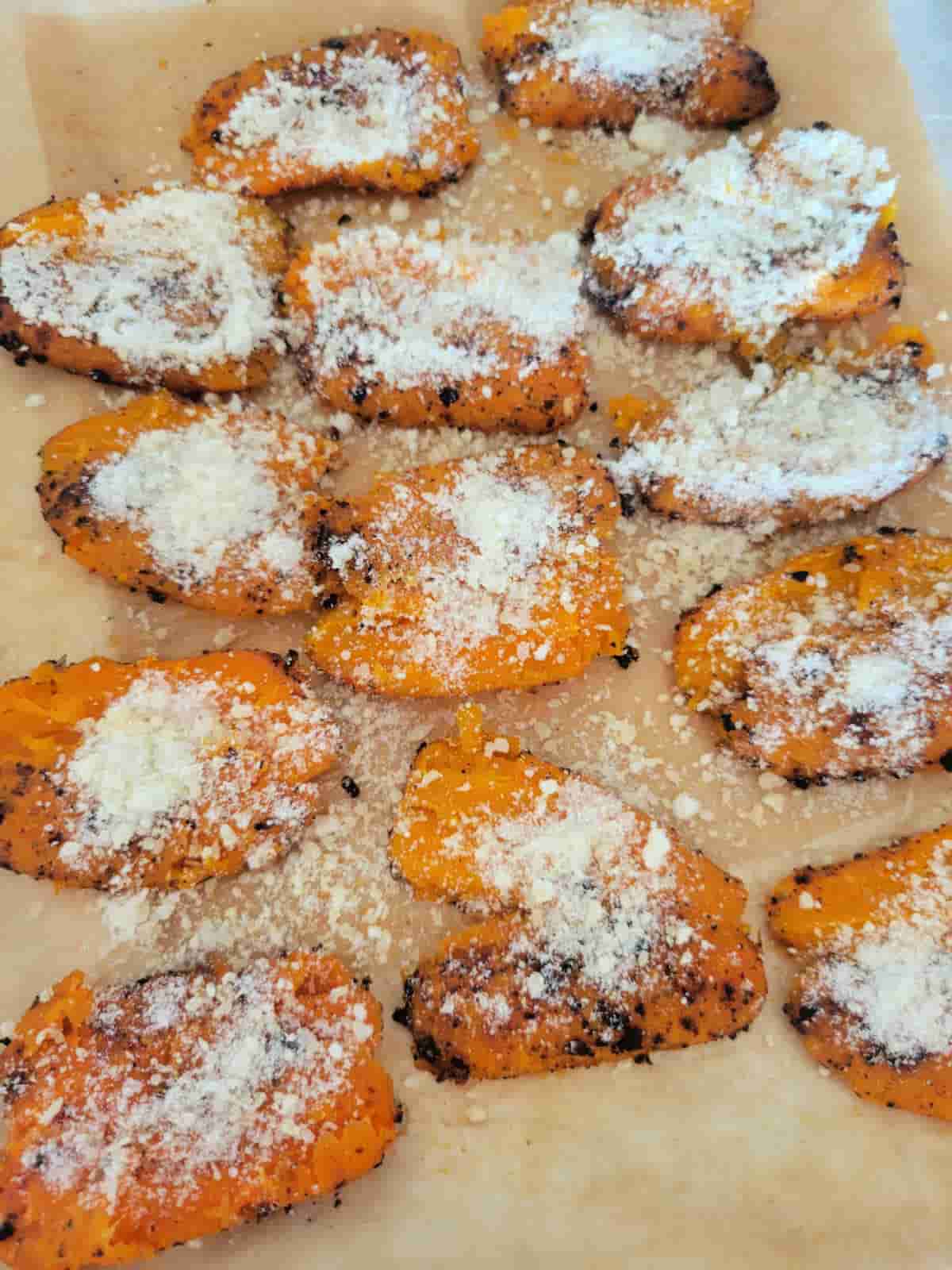 smashed carrots sprinkled with parmesan cheese