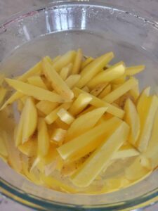 potato slices soaked in water and baking soda