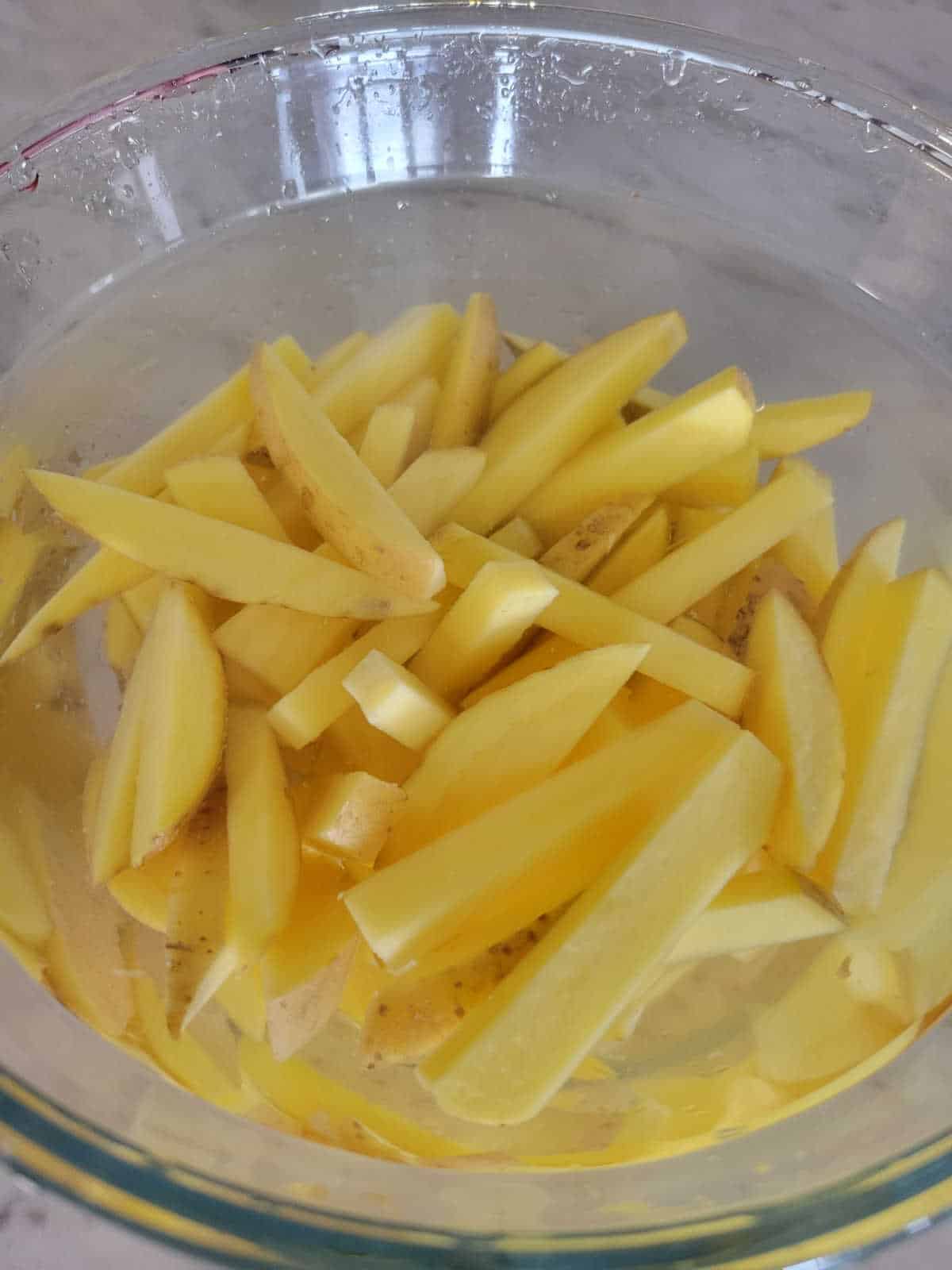 potato slices soaked in water and baking soda
