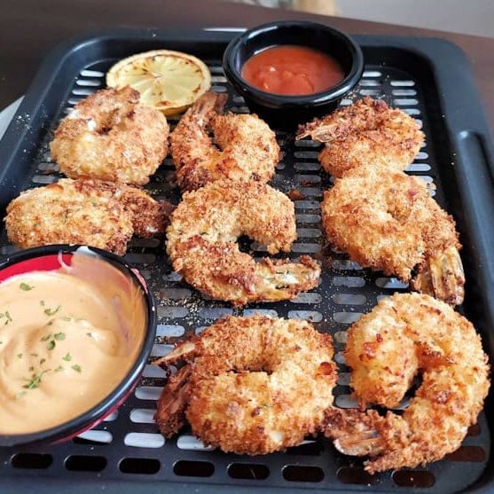 crispy breaded shrimp in air fryer basket