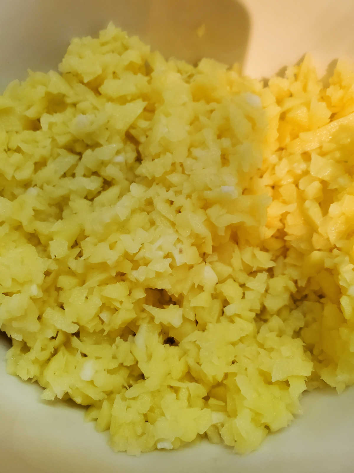finely shredded raw potatoes