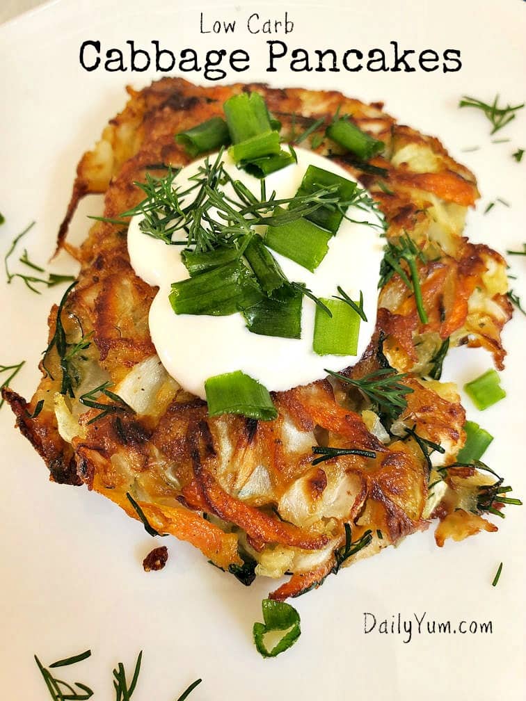 crispy golden cabbage pancake with sour cream on top