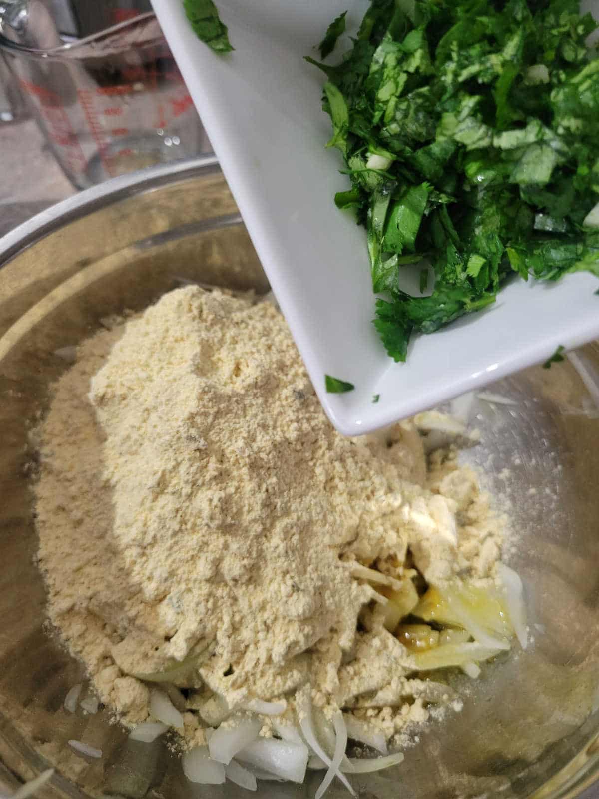 spice mix with sliced onion and chopped cilantro for onion fritters