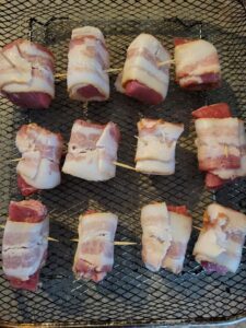 pieces of steak wrapped in bacon and secured with toothpicks