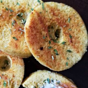 round beautifully charred slice of bread from a mug