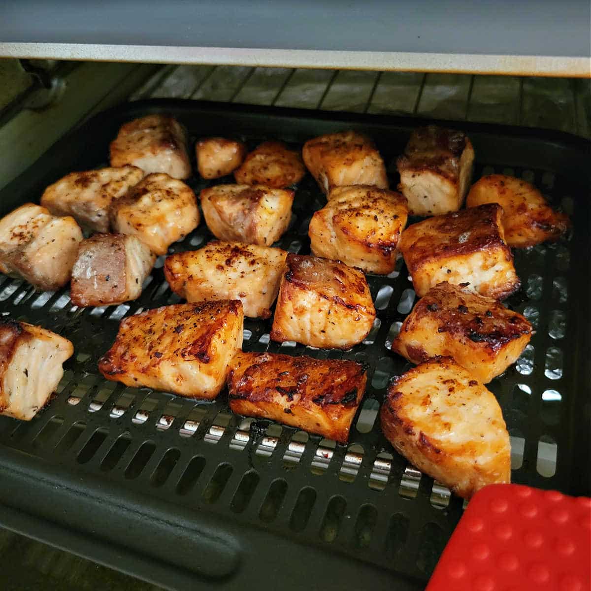 roasted salmon bites in air fryer basket