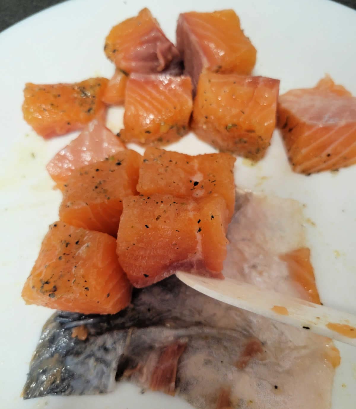 image shows how salmon is being removed from the skin