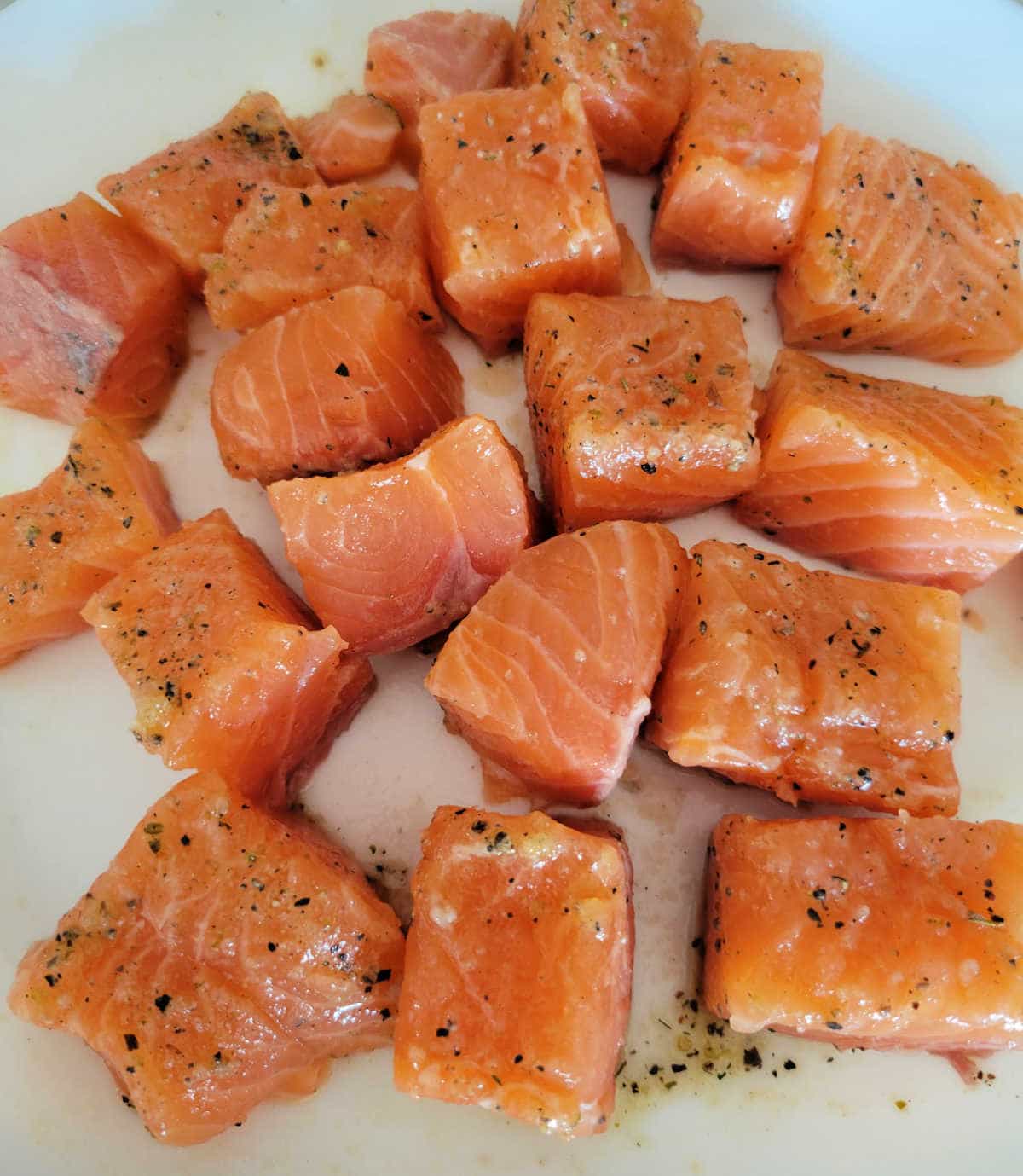 raw salmon filet cut into small bite-size cubes