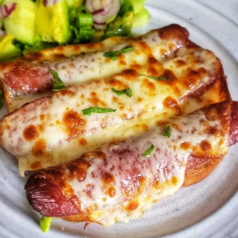 melted cheese, toasted bread, and savory hot dog slices