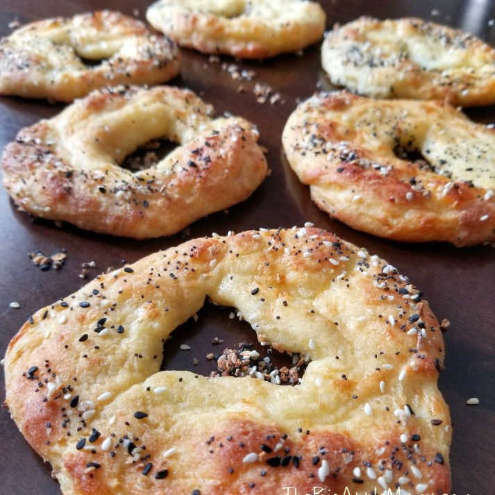 Keto low carb bagels made with almond flour and cheese, golden brown and topped with everything bagel seasoning.